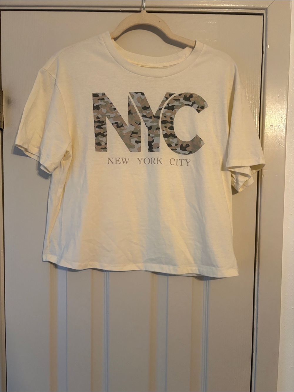 Rebellious One Cream Tee with Camo NYC Graphic